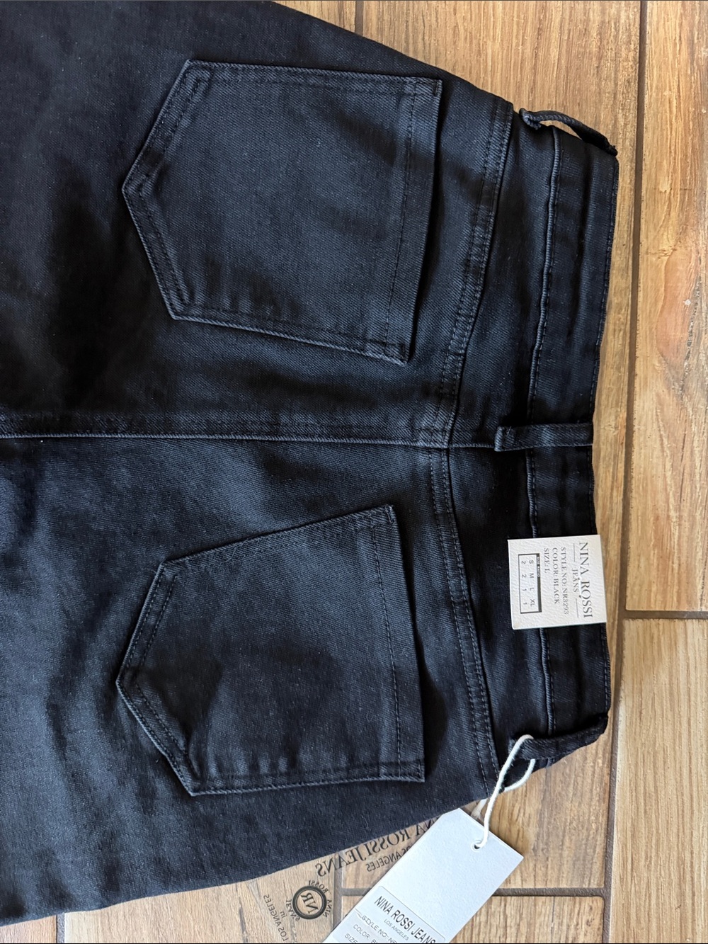 Nina Rossi Black Wide-Leg Jeans with Button Accent - Picture 4 of 5